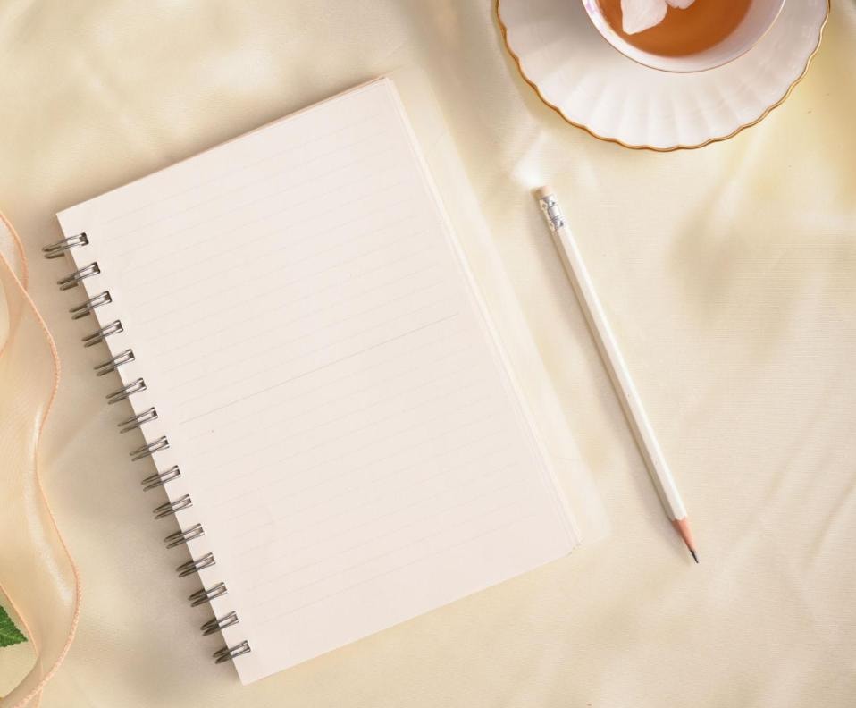 Journal on a linen surface with botanical details